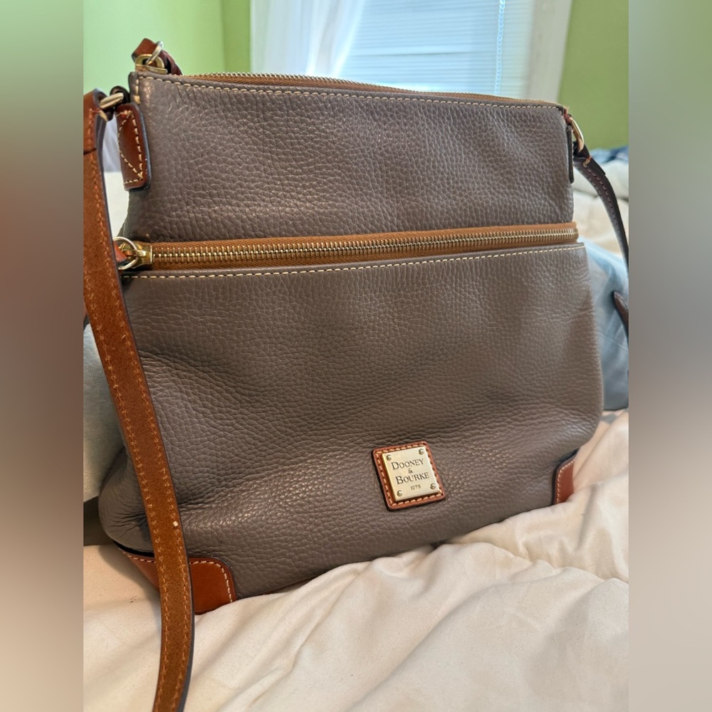 Dooney & Bourke pebble leather bag. Gold hardware, red interior.